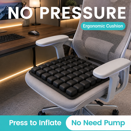 A black inflatable seat cushion with raised square pods shown installed on a light gray office chair in a home office setting. Large text overlays read 'NO PRESSURE', 'Ergonomic Cushion', 'Press to Inflate', and 'No Need Pump'.